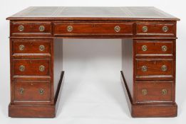 A Victorian mahogany pedestal desk with gilt tooled leather top, each pedestal with three drawers,