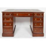 A Victorian mahogany pedestal desk with gilt tooled leather top, each pedestal with three drawers,