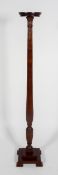 An Edwardian mahogany torchere,