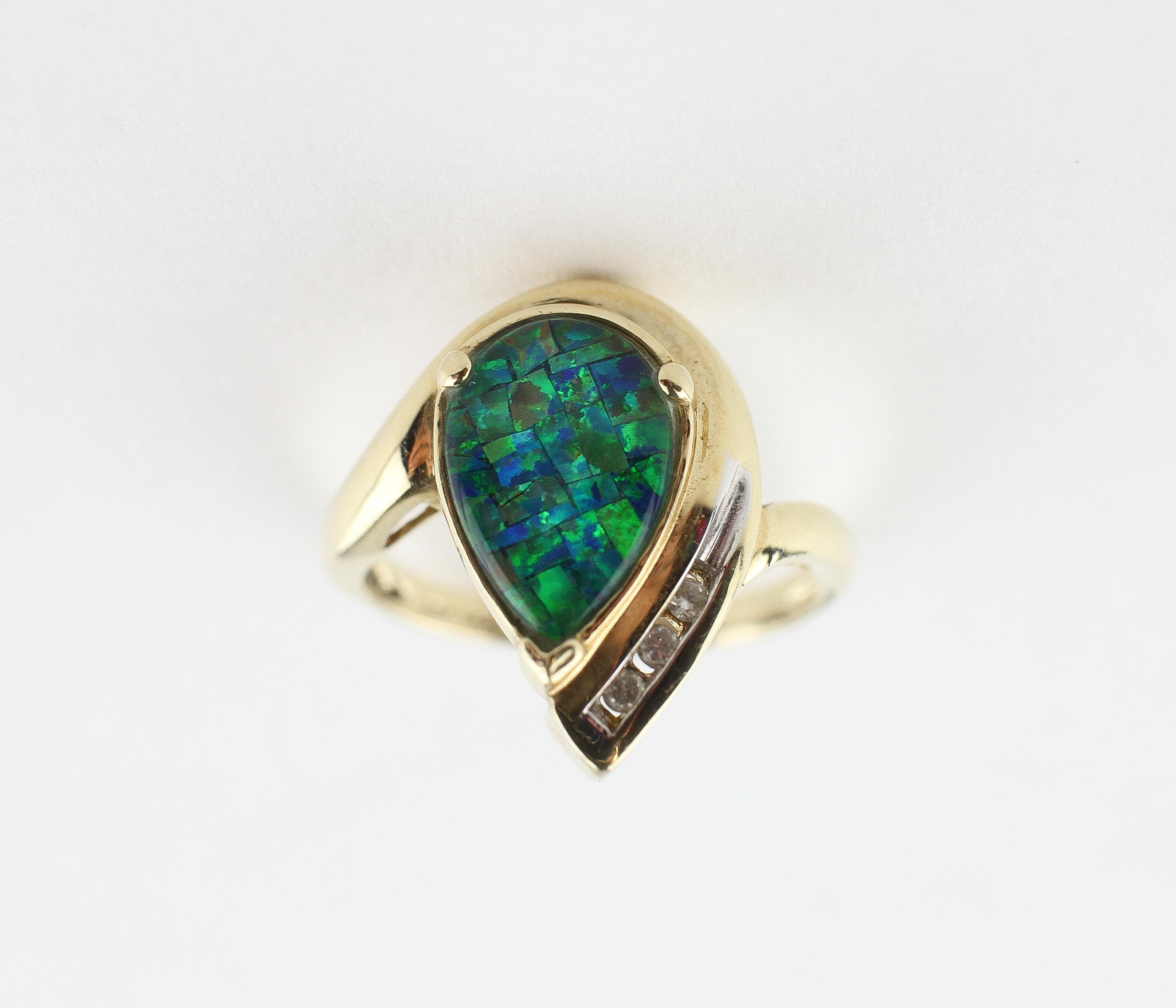 A yellow metal ring set with a synthetic mosaic opal triplet and finished with three diamonds. - Image 2 of 3