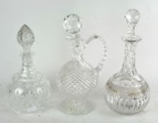 Three cut glass decanters, with non-matching stoppers,