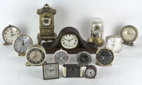 A group of various clocks, to include Smiths alarm,