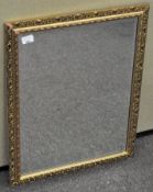 A vintage gilt framed bevelled glass wall mirror,