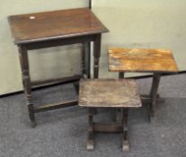 A mahogany occasional table and two smaller oak side tables, 73cm x 60cm x 43cm.