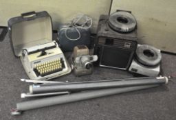 A collection of assorted items, including an Aldis projector, other projectors, screens,