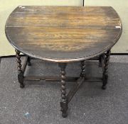 An oak barley twist drop leaf table , 73cm x 104cm x 54cm.