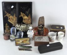 An assorted collection of items, including pens,