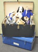 A large travelling trunk containing various items including ice skates, dressing table mirror,