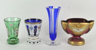 Four pieces of overlay glass, all being vases or dishes,