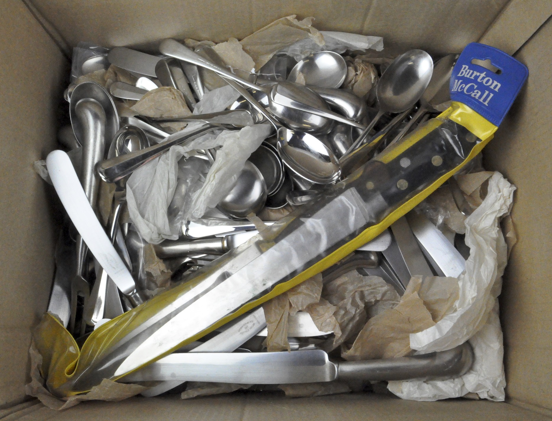 A group of stainless steel flatware