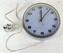 A vintage Metamec wall clock, light blue in colour, with Arabic numerals denoting hours,