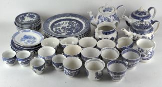 A collection of 'Willow' pattern blue and white ceramics, to include teapots, cake plates,