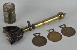 A brass trench art lighter, in the Glastonbury style,