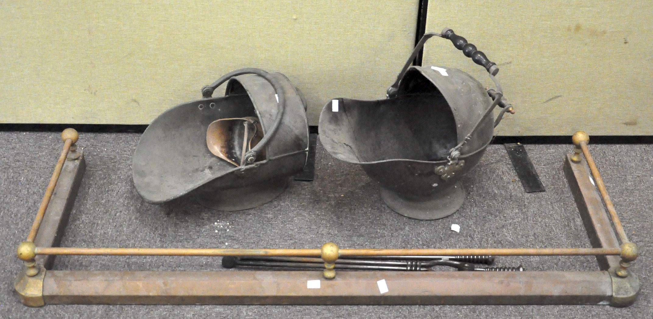 Two copper coal scuttles and a pair of fire irons