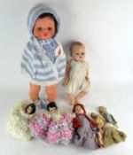 A collection of assorted dolls and clothing