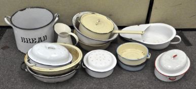 Assorted enamel kitchen and cookware items, including oven dishes, bread bin, pots and more,
