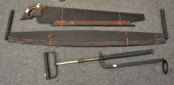 Two early saws, one a two handled example, largest 132cm wide,