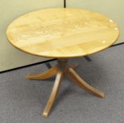 An elm dining table of circular form,