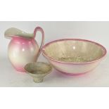 A vintage pink wash bowl and jug,