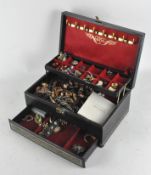 A vintage jewellery box, containing a variety of costume jewellery, including clip-on earrings,