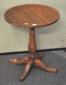A round topped occasional table, raised on turned column and splayed legs,