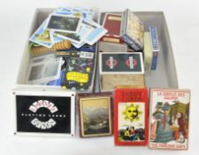 A collection of various playing cards, most being traditional,