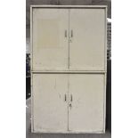 A large two tier metal storage cabinet, each tier with two opening doors,