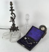 Assorted curios, to include an odoscope set, table lamp with a putti figure, decanter,