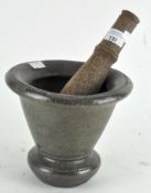 A salt glazed mortar and turned wooden pestle,