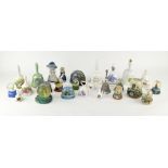 A collection of assorted ceramic bells and snow globes