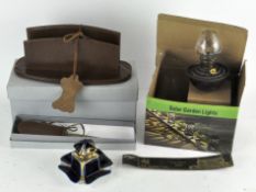 A collection of items, to include a letter opener, leather letter holder,