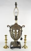 A modern metal table lamp, of stylised urn form,