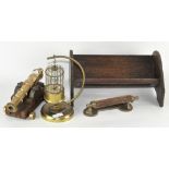 A novelty brass model of a canon, together with a musical brass bird cage,