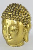 A large gilt painted Buddha head,