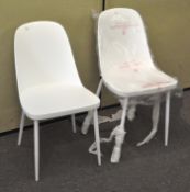 A pair of modern white 'Helev' dining chairs
