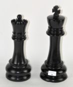 Two Andrew Martin chess pieces, a King and Queen,