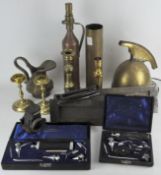 A collection of metalware, to include a repro helmet,