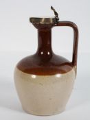 A silver mounted salt glazed stoneware flagon, the cover engraved with a crest,