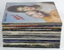 A collection of assorted vinyl LP's, to include Police, David Bowie, Queen, Genesis and more,