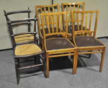 A set of four modern dining chairs,
