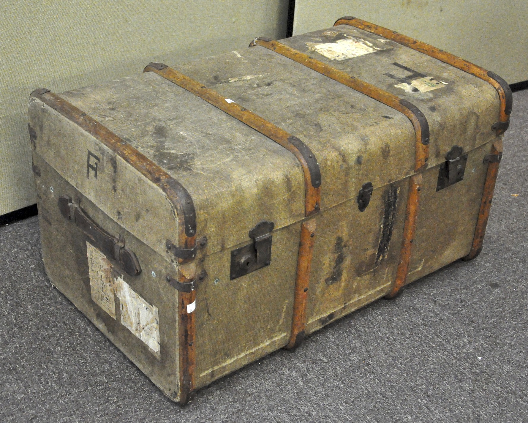 A vintage wooden and canvas bound travelling steamer trunk, 45cm high x 81cm wide x 52cm deep,