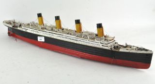 A model of a steamer ship with four funnels,