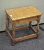 A 20th century oak stool, of rectangular form,