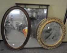 Three mirrors, to include an oval mahogany mirror, circular gilt framed example and another,