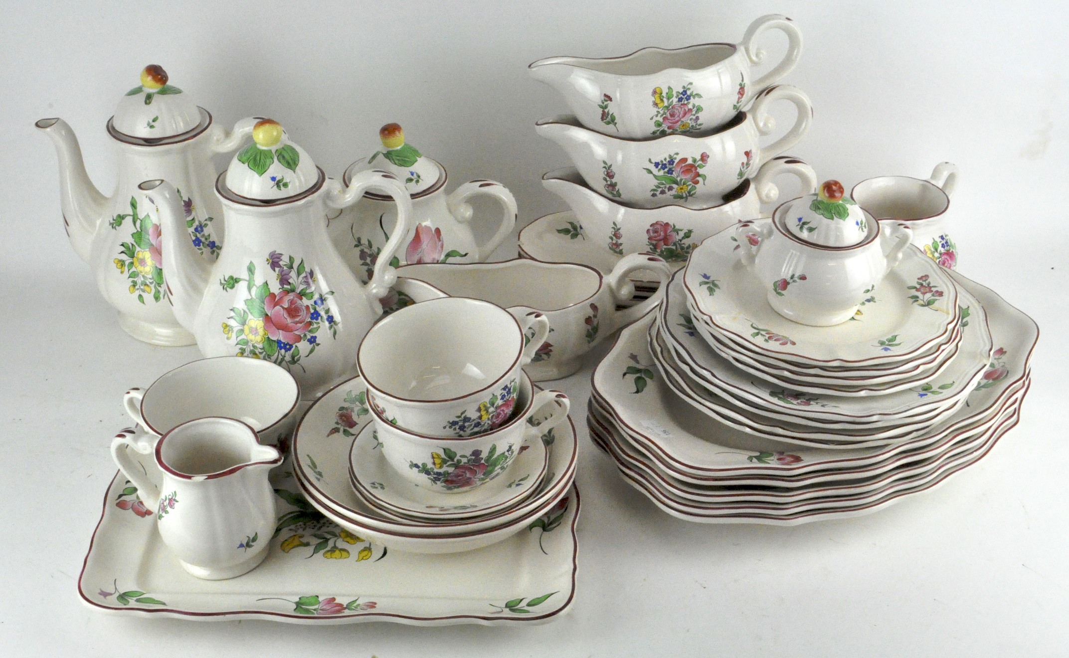 A French 'Luneville' part dinner service, to include sauce boats, coffee pot, teapot,