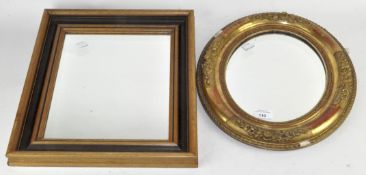 Two 20th century wall mirrors, one of oval form with gilt frame,