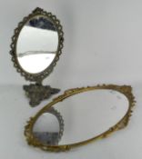 A gilt framed hall mirror of oval form, 67cm x 38cm,