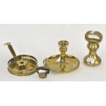 Two brass chamber sticks; together with a cased set of weights and a large weight,