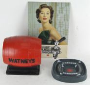 A vintage Watney's red plastic beer barrel dispenser,
