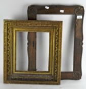 A gilt picture frame and an oak frame with anchors,